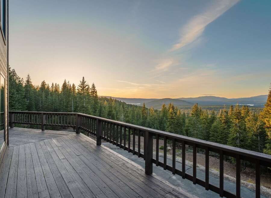 Enjoy breathtaking views from this stunning property! This home features a spacious deck, perfect for relaxing and taking in the natural beauty.