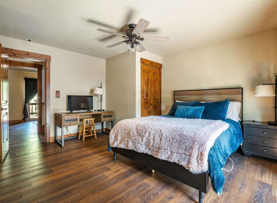 Step into this inviting bedroom, featuring a cozy bed with plush bedding and stylish decor.