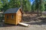 Nestled in a serene wooded setting, this charming cabin offers a tranquil escape.