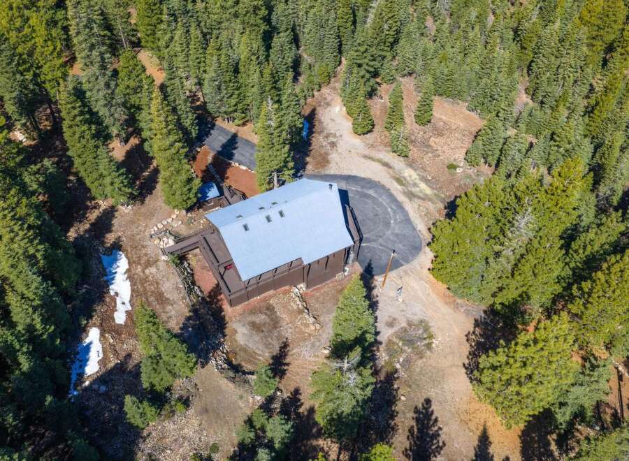 Nestled amidst a lush forest, this stunning property offers a serene escape.