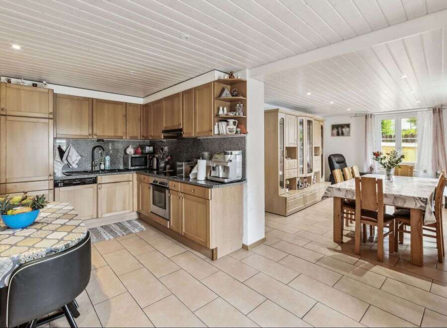This charming property boasts a well-equipped kitchen with modern appliances and ample storage, perfect for culinary enthusiasts.