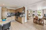 This charming property boasts a well-equipped kitchen with modern appliances and ample storage, perfect for culinary enthusiasts.