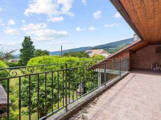 Enjoy breathtaking views from this charming balcony.