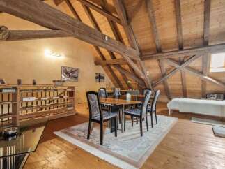 Discover the charm of this unique property featuring a stunning wooden beamed ceiling and a spacious open-plan living area.