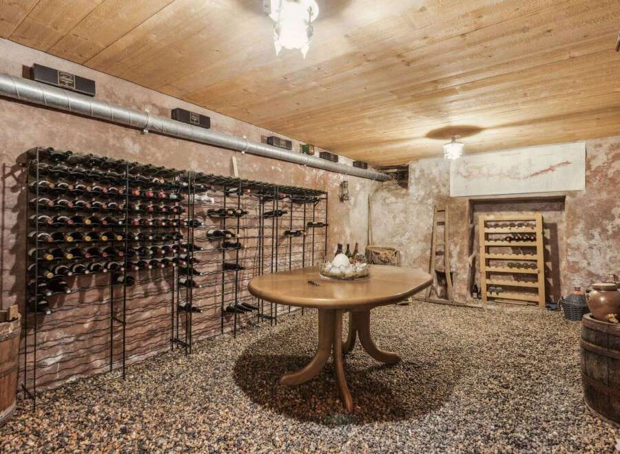 Step into a wine lover's paradise with this stunning wine cellar.