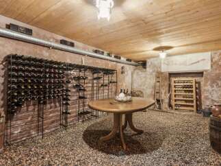 Step into a wine lover's paradise with this stunning wine cellar.