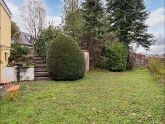Discover the charm of this property, featuring a beautifully landscaped backyard.