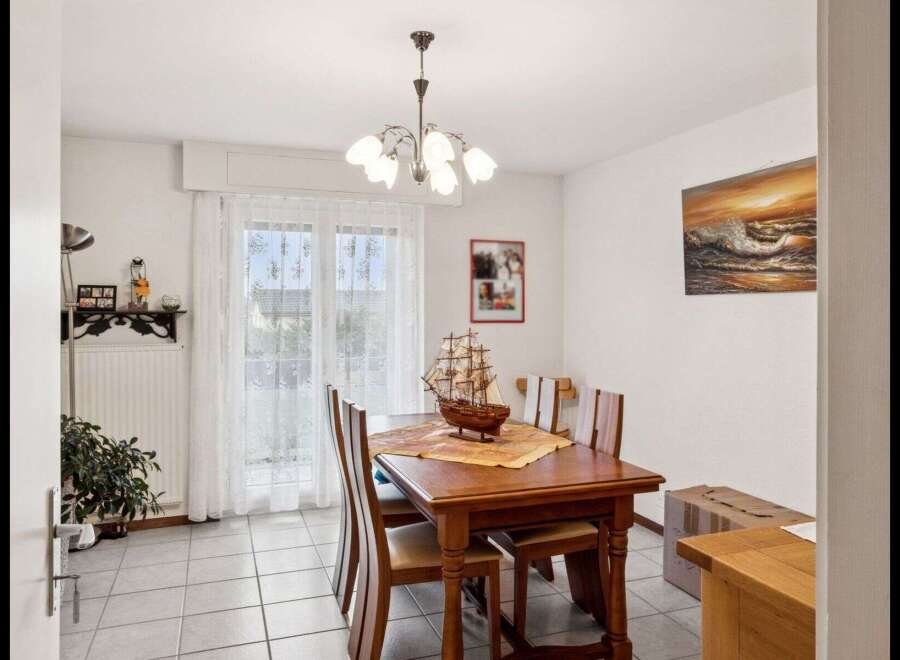 Step into this inviting dining room, perfect for family gatherings and entertaining guests.