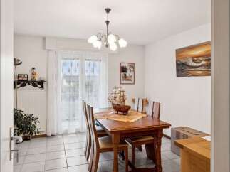 Step into this inviting dining room, perfect for family gatherings and entertaining guests.
