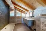 Experience luxury in this stunning bathroom, featuring a modern floating vanity and sleek fixtures.
