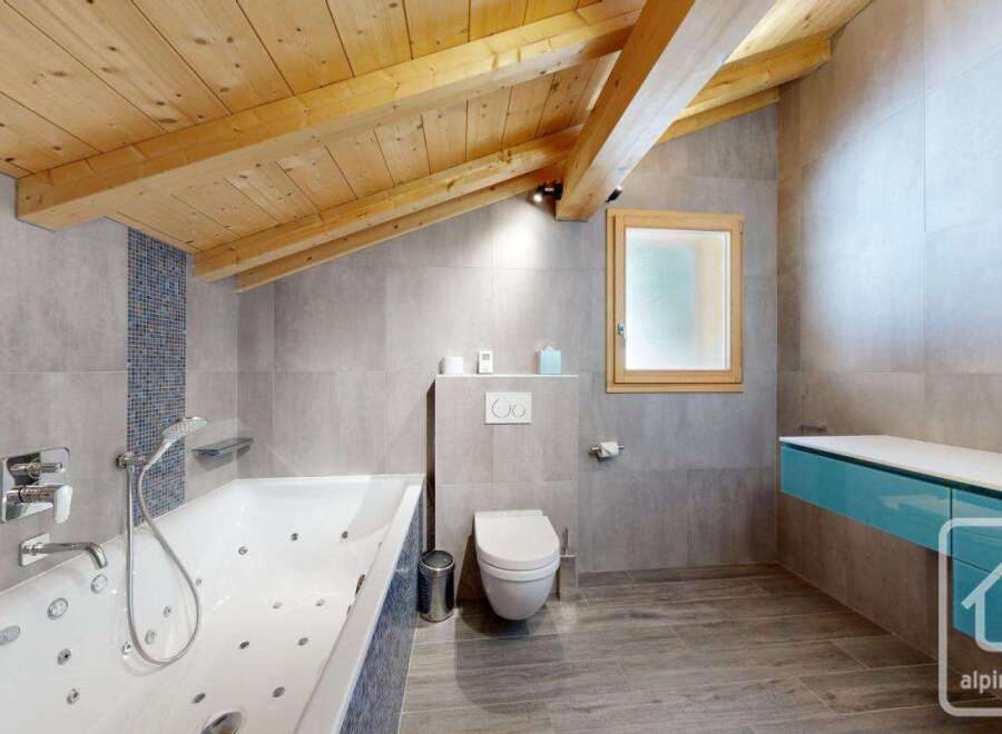 This stunning bathroom boasts a luxurious jacuzzi tub, perfect for relaxation.