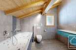 This stunning bathroom boasts a luxurious jacuzzi tub, perfect for relaxation.