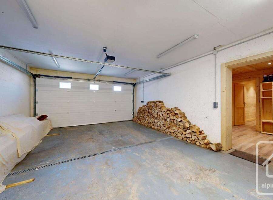 Discover the potential of this versatile property! This space features a spacious garage with ample room for vehicles or storage.