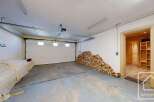 Discover the potential of this versatile property! This space features a spacious garage with ample room for vehicles or storage.