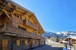 Discover the charm of this stunning wooden chalet, perfectly nestled in a picturesque mountain setting.