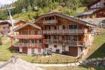Discover the charm of this stunning chalet nestled in a picturesque mountain setting.