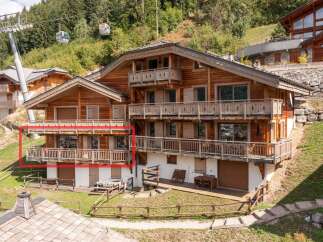 Discover the charm of this stunning chalet nestled in a picturesque mountain setting.