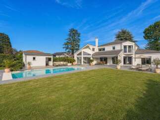 Discover luxury living in this stunning property featuring a private pool and expansive green lawn, perfect for outdoor enjoyment.