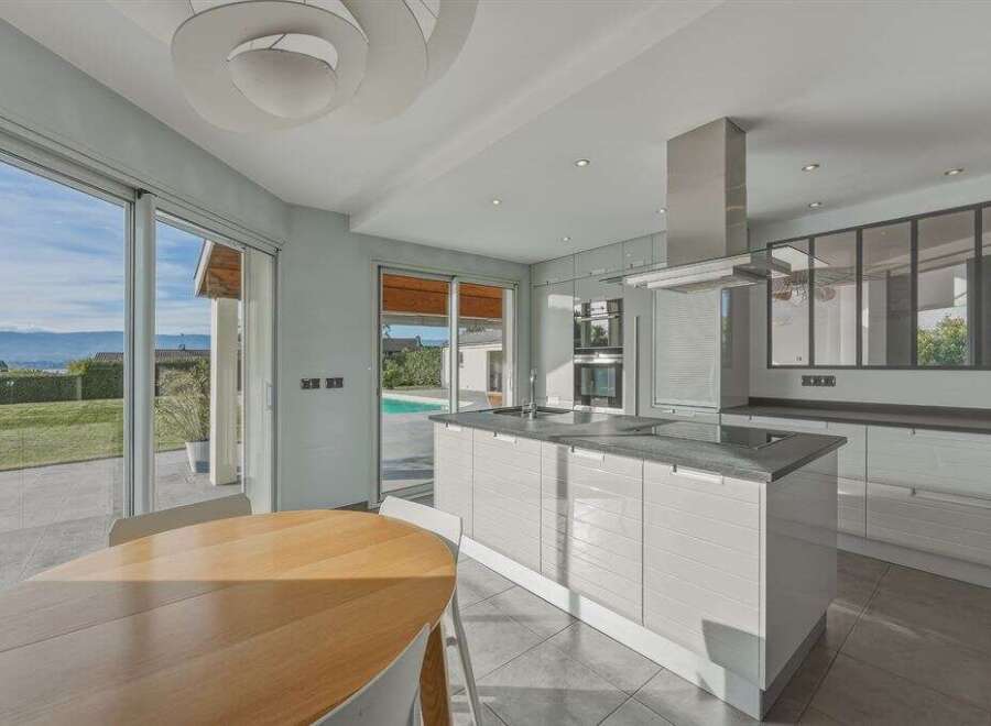 This stunning kitchen boasts modern design and seamless indoor-outdoor living.
