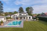 This stunning property boasts a luxurious outdoor space, perfect for relaxation and entertainment.