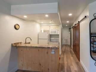 Discover this charming property featuring a well-equipped kitchen with modern appliances and ample counter space.