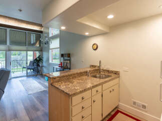 This stunning property boasts a modern kitchen with granite countertops and ample cabinet space, perfect for culinary enthusiasts.