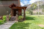 This stunning property boasts a charming exterior with a welcoming porch and a beautifully landscaped yard.