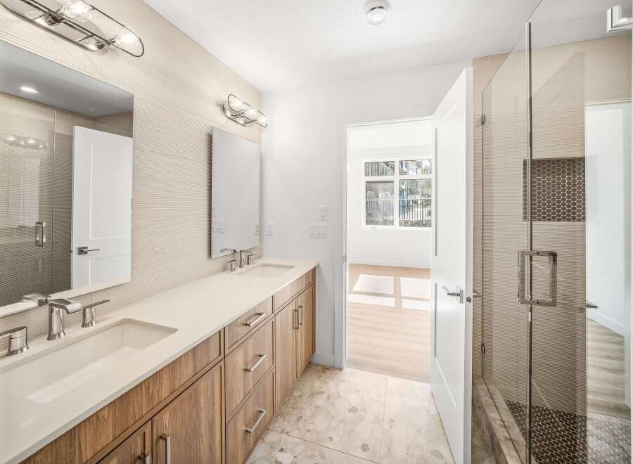 Step into luxury with this stunning bathroom, featuring a sleek design and modern amenities.