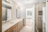 Step into luxury with this stunning bathroom, featuring a sleek design and modern amenities.