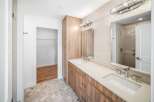 Step into luxury with this stunning bathroom featuring a sleek double vanity and modern fixtures.