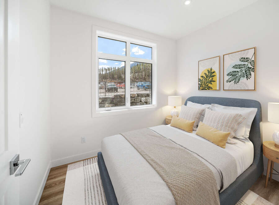This cozy bedroom offers a serene retreat with its inviting ambiance and stylish decor.