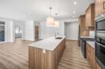 This stunning kitchen boasts a modern design with sleek cabinetry and a spacious island, perfect for both cooking and entertaining.