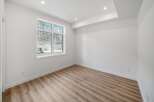This bright and airy room features a large window that offers stunning views of the surrounding landscape.