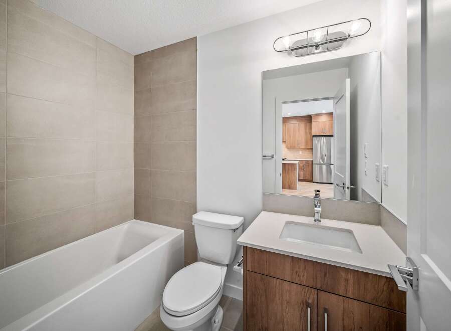 This modern bathroom features a sleek design with a combination of functionality and style.