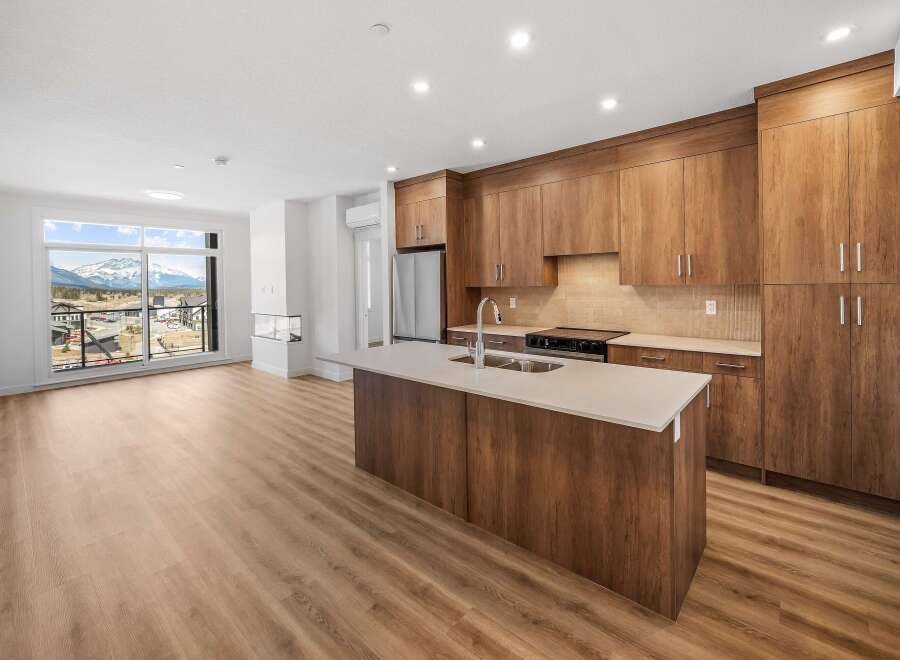 This stunning kitchen boasts modern design with sleek cabinetry and a spacious island, perfect for culinary enthusiasts.