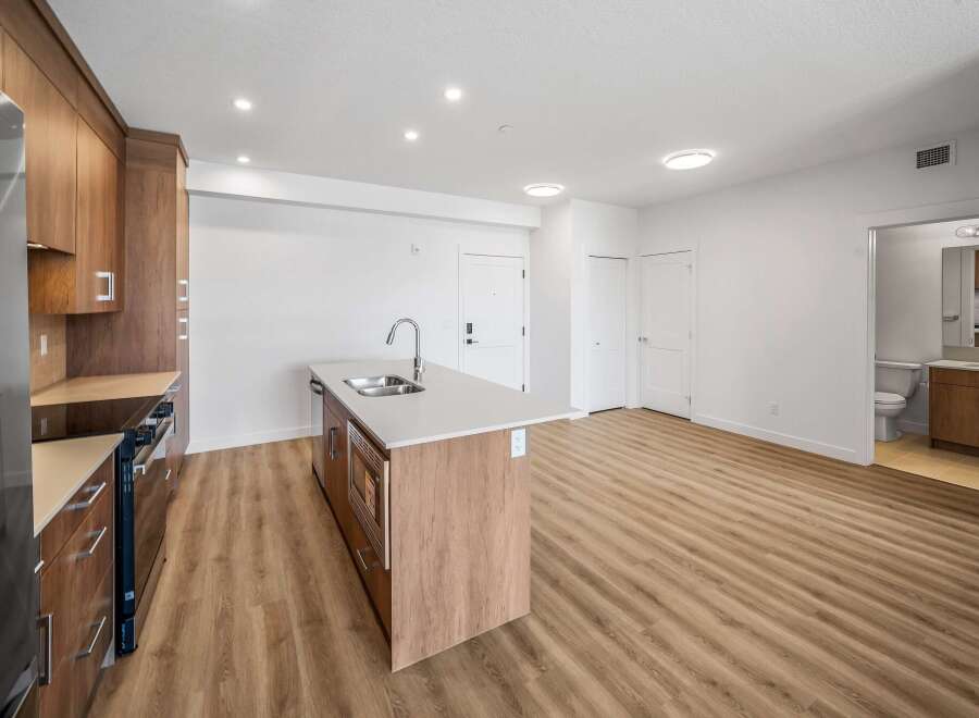 Step into modern elegance with this stunning kitchen! Featuring sleek cabinetry, a spacious island, and stainless steel appliances, this space is perfect for both cooking and entertaining.