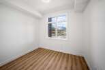 This bright and airy room features a large window offering stunning mountain views, perfect for enjoying the natural beauty.