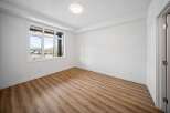 This bright and airy room features a large window that offers stunning views.