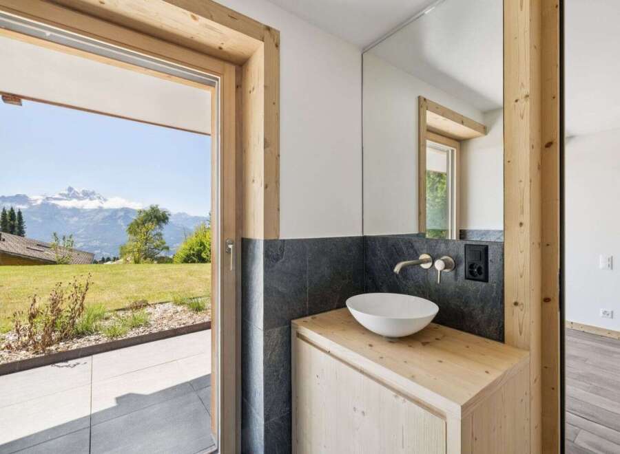 Experience the epitome of luxury living with this stunning property, boasting breathtaking mountain views visible from the bathroom.
