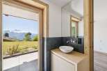 Experience the epitome of luxury living with this stunning property, boasting breathtaking mountain views visible from the bathroom.