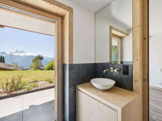 Experience the epitome of luxury living with this stunning property, boasting breathtaking mountain views visible from the bathroom.