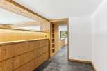 This stunning property boasts a beautifully designed interior with natural wood accents throughout.