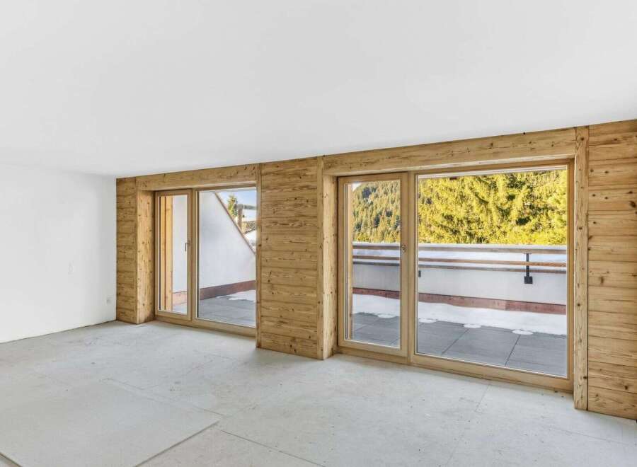 This stunning property boasts expansive windows that flood the interior with natural light, offering breathtaking views of the surrounding landscape.