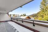 Enjoy breathtaking mountain views from this stunning balcony.