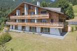 Discover the charm of this stunning wooden chalet nestled in a picturesque mountain setting.