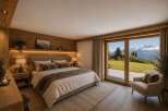 Experience luxury mountain living in this stunning bedroom, featuring a cozy king-sized bed adorned with plush faux fur throws and accent pillows.