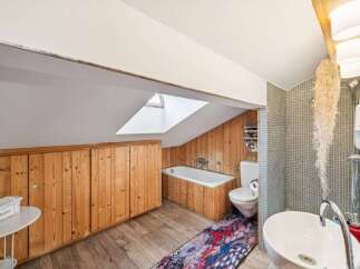 Discover the charm of this unique bathroom, featuring a skylight that floods the space with natural light.