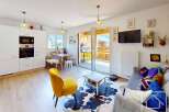 Discover this charming property featuring a modern kitchen with integrated appliances and a cozy living area.
