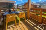 Enjoy breathtaking mountain views from this charming balcony.