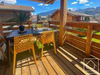 Enjoy breathtaking mountain views from this charming balcony.